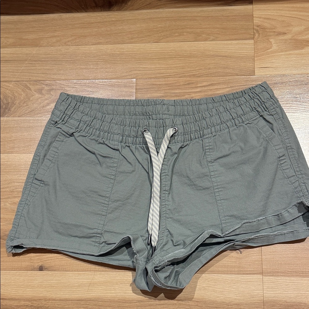 Vuori Women's Athletic Shorts in olive green,